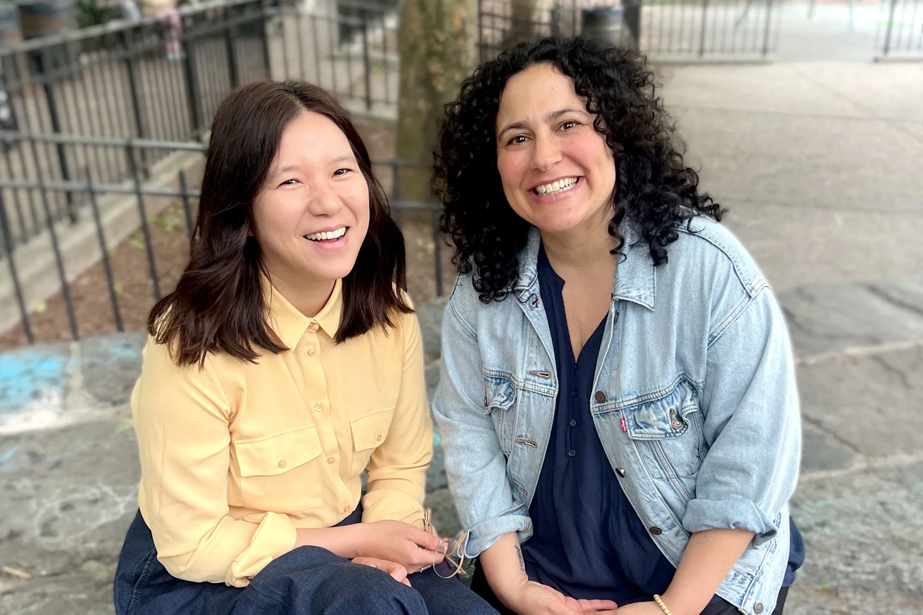 A picture of Michelle and Jena who host the 'Did you see?' podcast in a park.